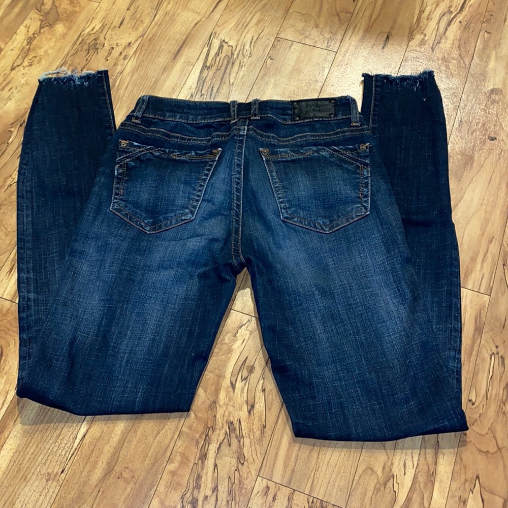 Buckle black skinny jeans